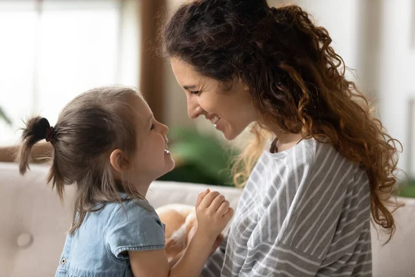 Mother and little daughter looking at each other with love — Stock Photo, Image