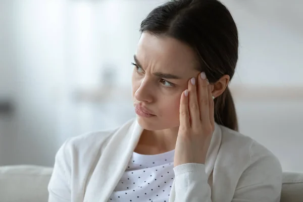Frustrated unhealthy woman touching temples, suffering from strong headache. — Stock Photo, Image