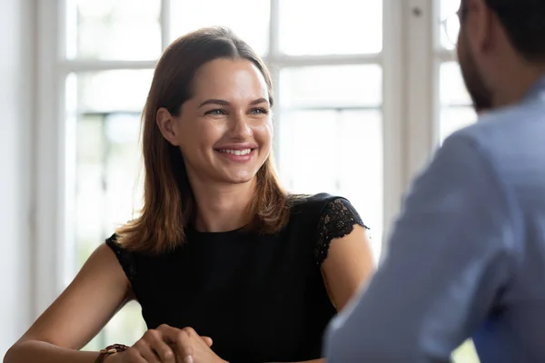 Smiling colleagues talk discuss ideas at meeting — Stock Photo, Image