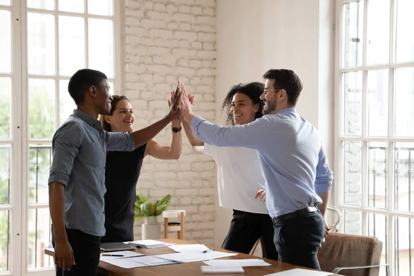 Excited diverse coworkers give high five celebrate success — Stock Photo, Image