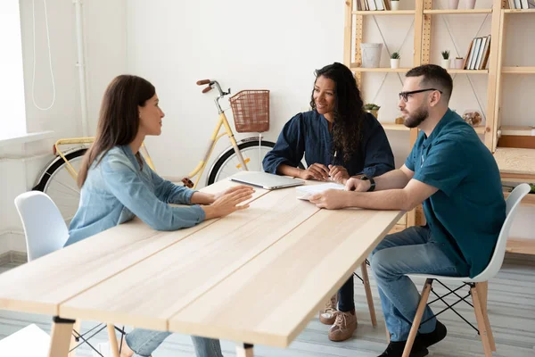 Smiling diverse hr managers listening to candidate at meeting