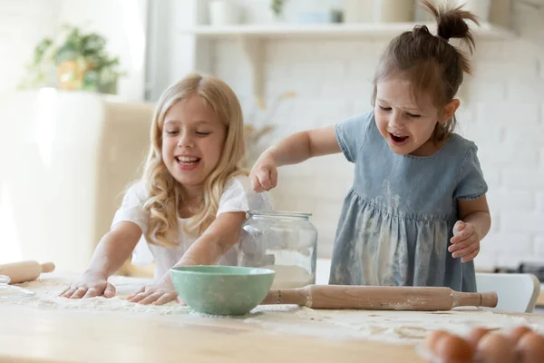 Cute girls discovering the world of cooking