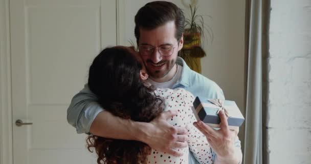 Pleased husband hug wife feels grateful for gift — Stock Video