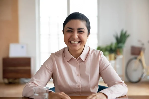 Portrait of smiling indian female speak on video call — Stock Photo, Image