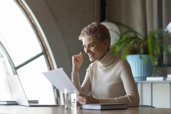 Happy female employee get good news in paperwork — Stock Photo, Image