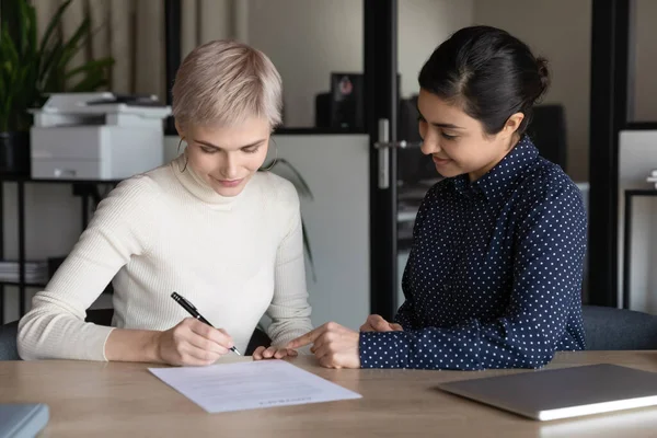 Caucasian female employee sign document at meeting — Stock Photo, Image