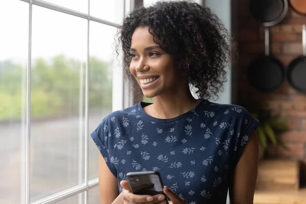 Happy African American woman look in distance visualizing — Stock Photo, Image