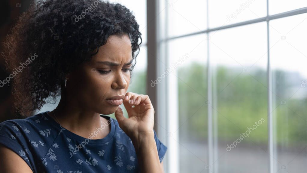 Unhappy young biracial woman feel lonely depressed at home