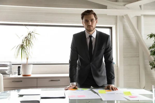 Portrait of young successful businessman in modern office. — Stock Photo, Image