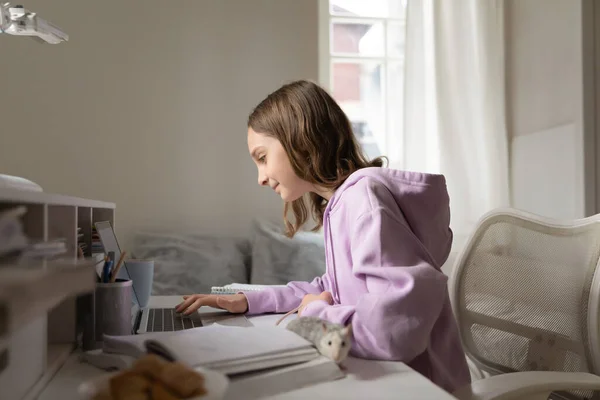 Happy teen schoolgirl study on laptop play with mouse — Stock Photo, Image