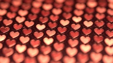 Kalpler arka plan gerçek malzemeden yapılmış, Sevgililer Günü kırmızı kalpler rotasyon arka plan hareketli. Saint Valentines hareket döngülü kavramı. Uhd 4k video.
