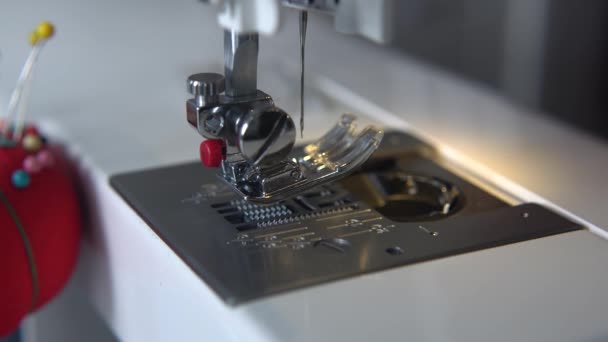 Tailor set up the needle for sewing. Sewing machine thread and lace close up. 4k. — Stock Video