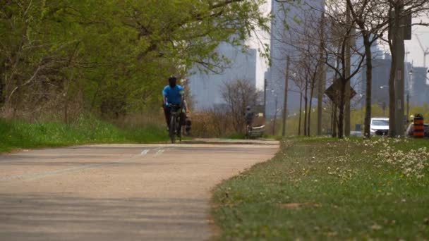 Toronto, Ontario, Canada - May 24, 2020 ActiveTO City initiatives, short-term clores of major streets, open up space for people who walk, run, use wheelchairs scooters and bikes during COVID 19 . — стоковое видео