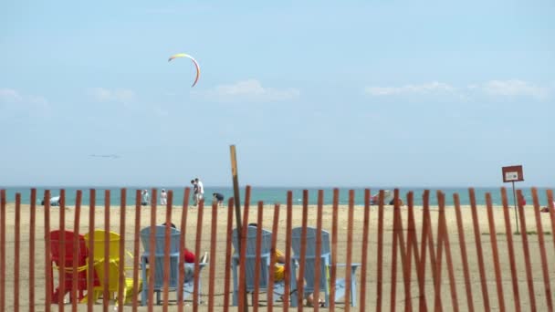 Toronto, Ontario, Canada - May 24, 2020 Lake Ontario Woodbine Beach on sunny day with wind kite surfers and people leisure, during COVID 19 coronavirus pandemic. Marine summer landscape. — Stock Video