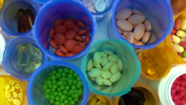 Various pills bottles macro close up shot. Production of medicines bottles. Pharmaceutical concept of healthcare, pharma industry, medication and drugs production. Medical research and trials. — Stock Video