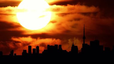Kuzey Amerika silueti silueti gün batımı zamanı. Şehir kuleleri ve şehir manzarası, güneş batarken renkli sıcak bulutlarla doluyor. Amerikan şehir merkezindeki sanat kolajının üzerine güneş battı. Sis 'in özel efektleri.