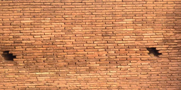Ancient red wall in Rome. Wall built up with red and old brick located in Rome.