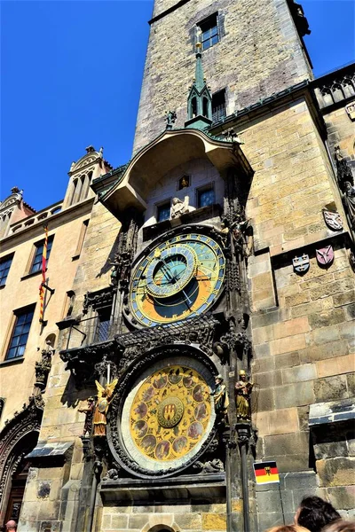 Ancient and historical buildings in Prague City. Czech Republic. The most famous historical buildings in Prague. Clock tower with blue sky background.