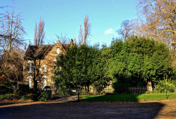 Beautiful parks in London. Regents Park, St. James Park. Green and blue stay together in the sky. During autumn.