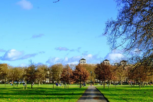 Beautiful parks in London. Regents Park, St. James Park. Green and blue stay together in the sky. During autumn.