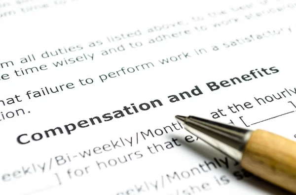 compensation and benefits contract  with wooden pen