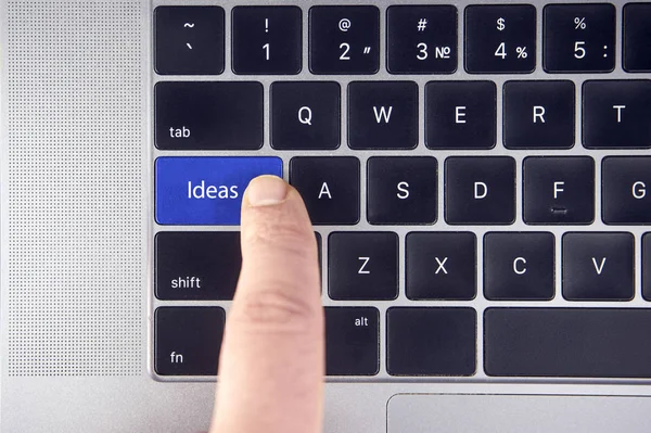 business concept shows as well as the fingers that press IDEAS on the keyboard laptop