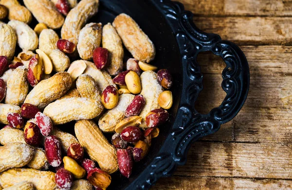 Peanuts Shell Dark Bowl Top View — Stock Photo, Image