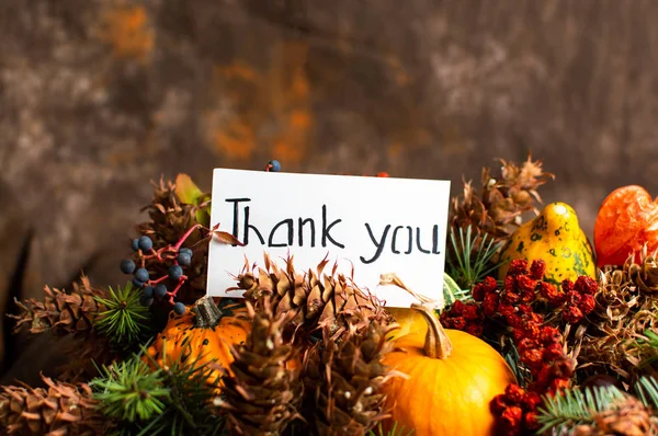 Thank you note and autumn festive symbols in a box