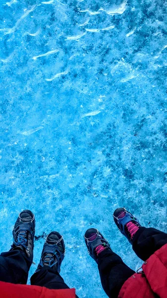 Couple Standing Glacier Ice Surface Wearing Crampons Pov Stock Picture