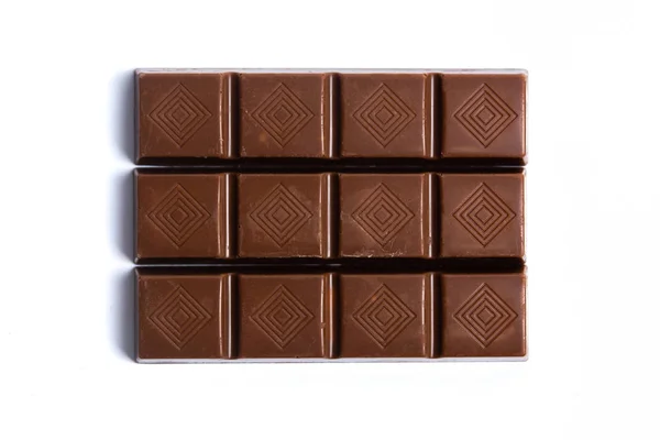 Pezzo di cioccolato isolato su bianco — Foto Stock