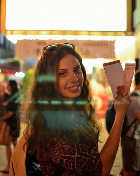 Girl holding tickets on Broadway — Stock Photo, Image