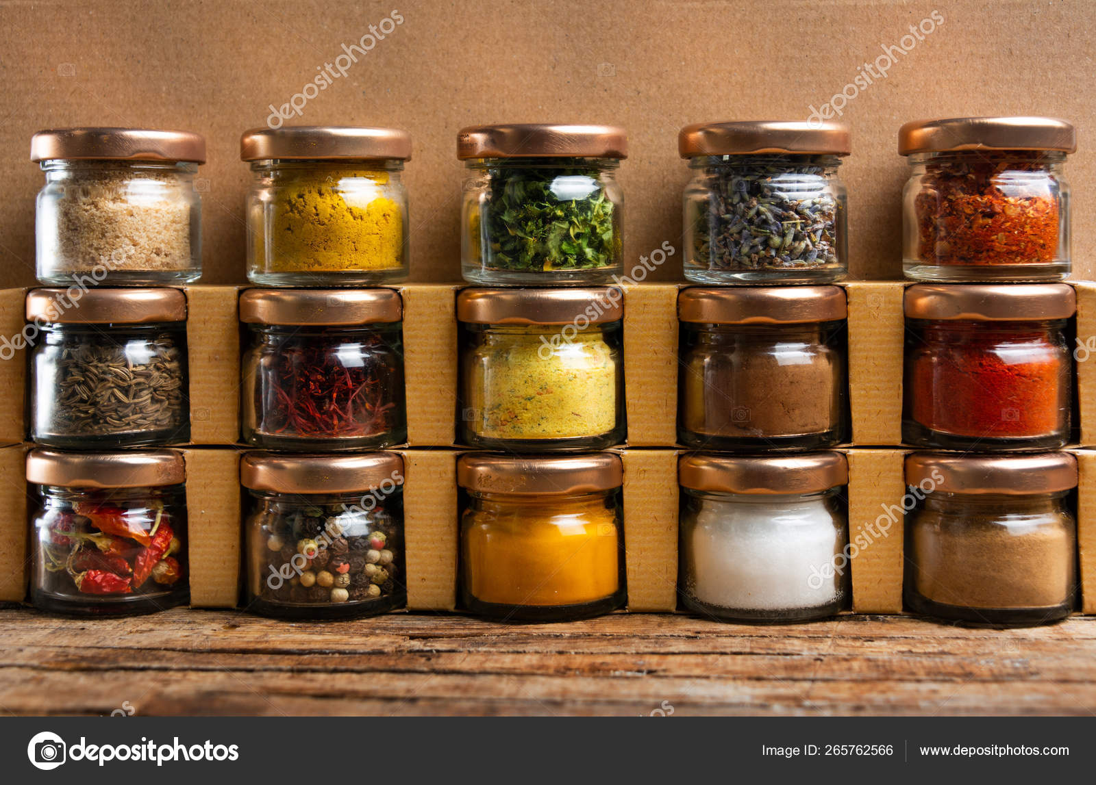 Large collection of spices in small jars Stock Photo by ©CreativeFamily  265762566