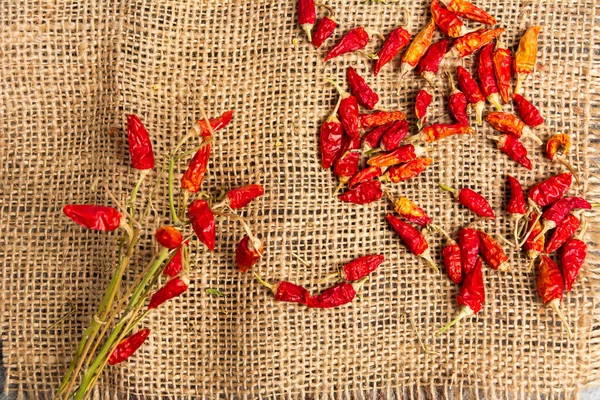 Dried red peppers on a rustic background — Stock Photo, Image