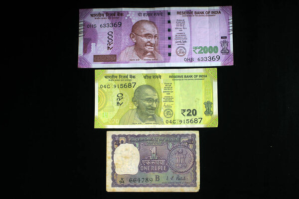 Indian Money with 2021 new year concept on black background. Concept of New Year 2021 with Indian currency. Indian currencies on black background.