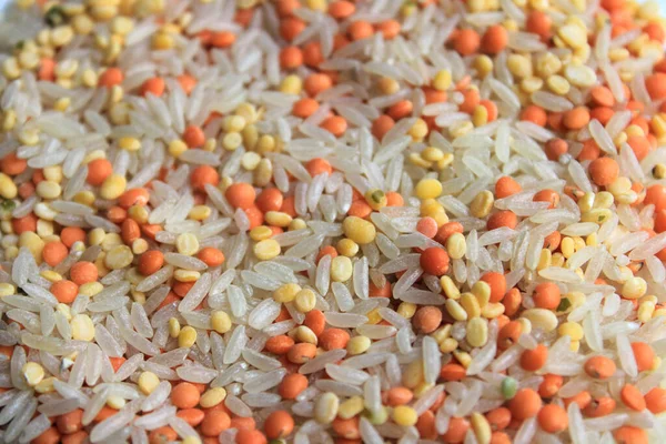 Pile of uncooked rice grain, red lentils and pigeon pea. Rice grains, Mung beans and red lentils isolated on white background. Dry food background.