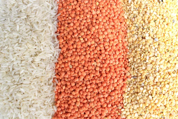 Pile of uncooked rice grain, red lentils and pigeon pea. Rice grains, Mung beans and red lentils isolated on white background. Dry food background.