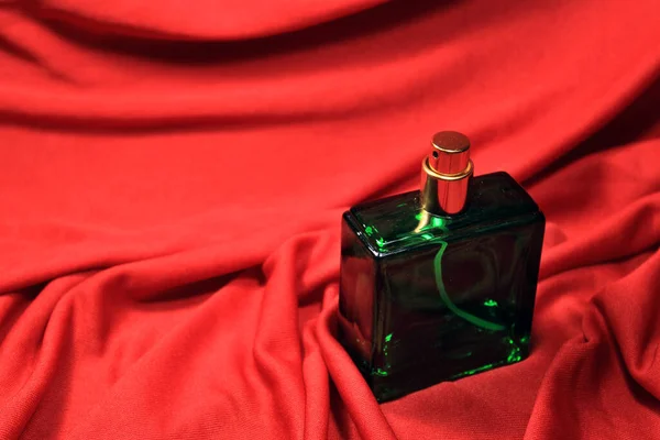 Green Color Perfume Bottle Female Accessories Isolated Red Background — Stock Photo, Image