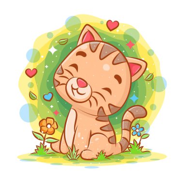 Yavru kedi oturuyor ve resimlerin bahçesinde gülümsüyor.