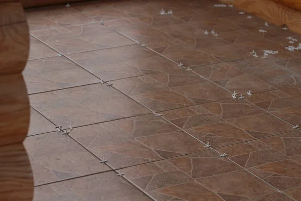 Ceramic Floor Tiles Crosses Installation — Stock Photo, Image