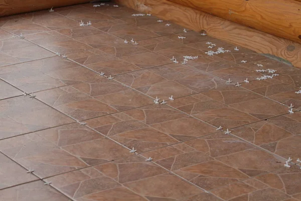 Ceramic Floor Tiles Crosses Installation — Stock Photo, Image