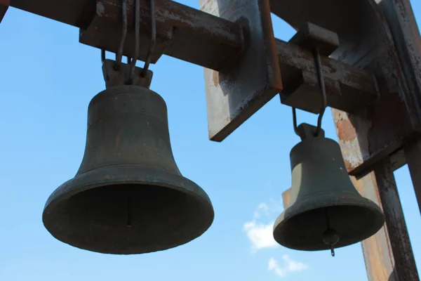 Two bells on the background of blue sky. — Stock Photo, Image