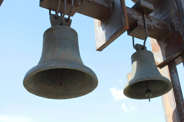 Two bells on the background of blue sky. — Stock Photo, Image