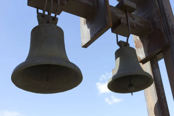 Two bells on the background of blue sky. — Stock Photo, Image