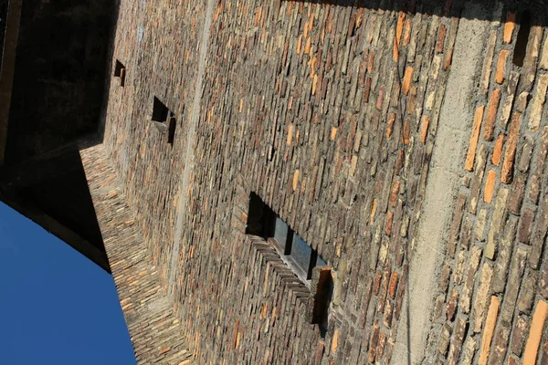 Stone wall tower with narrow windows