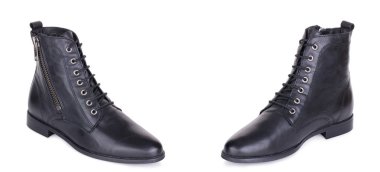 Klasik kadın deri düz ayak bileği çizmeler booties ayakkabı çifti. İki izole.