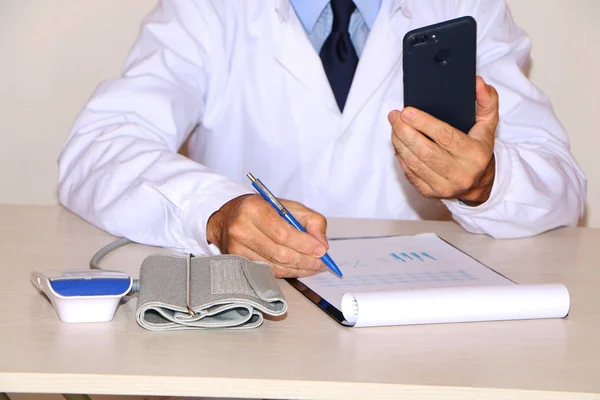 Close-up - doctor measures blood pressure