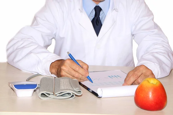 Close-up - the doctor advertises the benefits of apples.