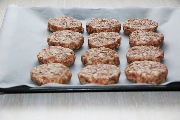 Raw minced meatballs cooked for frying in the oven. — Stock Photo, Image