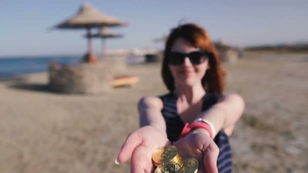 Bitcoin Girl Throws Bitcoin Coins Background Beach — Stock Video