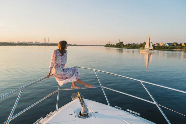 Yacht. The girl is sailing on a yacht